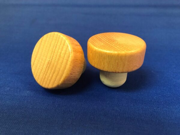 Two Natural Varnished 38x14/19.5 knobs on a blue background.