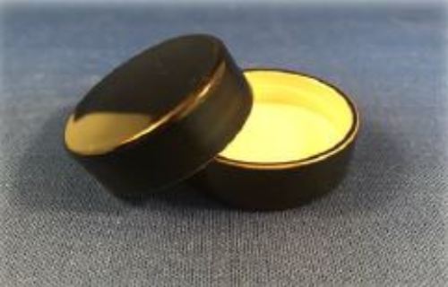 A small Black SCR 33-400 container with a white lid.